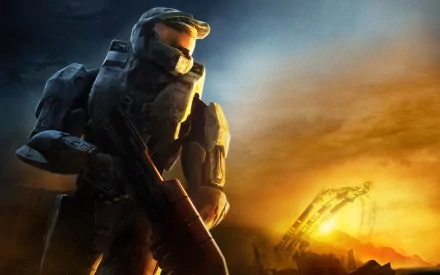 HD desktop wallpaper featuring a Halo video game character in futuristic armor, holding a rifle against a dramatic sky and industrial landscape backdrop.