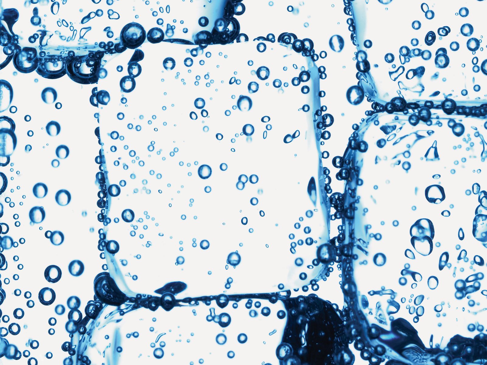 A captivating HD wallpaper featuring ice cubes submerged in water, bubbles rising around them, showcasing the beauty of nature and the cool allure of ice.