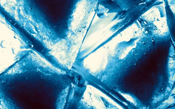 Close-up photography of ice cubes, showcasing intricate textures and reflections in vibrant blue tones, making for an attractive HD desktop wallpaper and background.