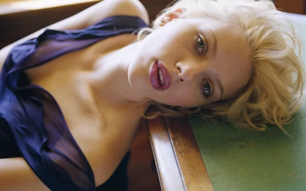 High-definition desktop wallpaper featuring a close-up of a celebrity tagged as Scarlett Johansson with a relaxed and elegant pose, highlighted by soft lighting and a serene atmosphere.