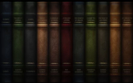 A collection of antique books with rich colors and textures, creating a sophisticated backdrop. This HD desktop wallpaper adds a touch of elegance to any PC.