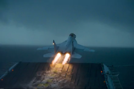 A Mikoyan MiG-29K jet takes off from an aircraft carrier amidst stormy skies, showcasing its military might in this high-definition desktop wallpaper.