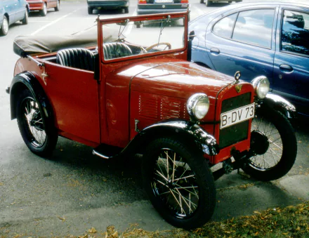 A vintage red BMW vehicle showcased as a 4K Ultra HD desktop wallpaper and background, highlighting classic automotive design and detail.