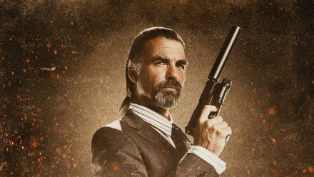 HD desktop wallpaper featuring Jeff Fahey as a character from the movie Machete, holding a handgun against a textured, fiery background.