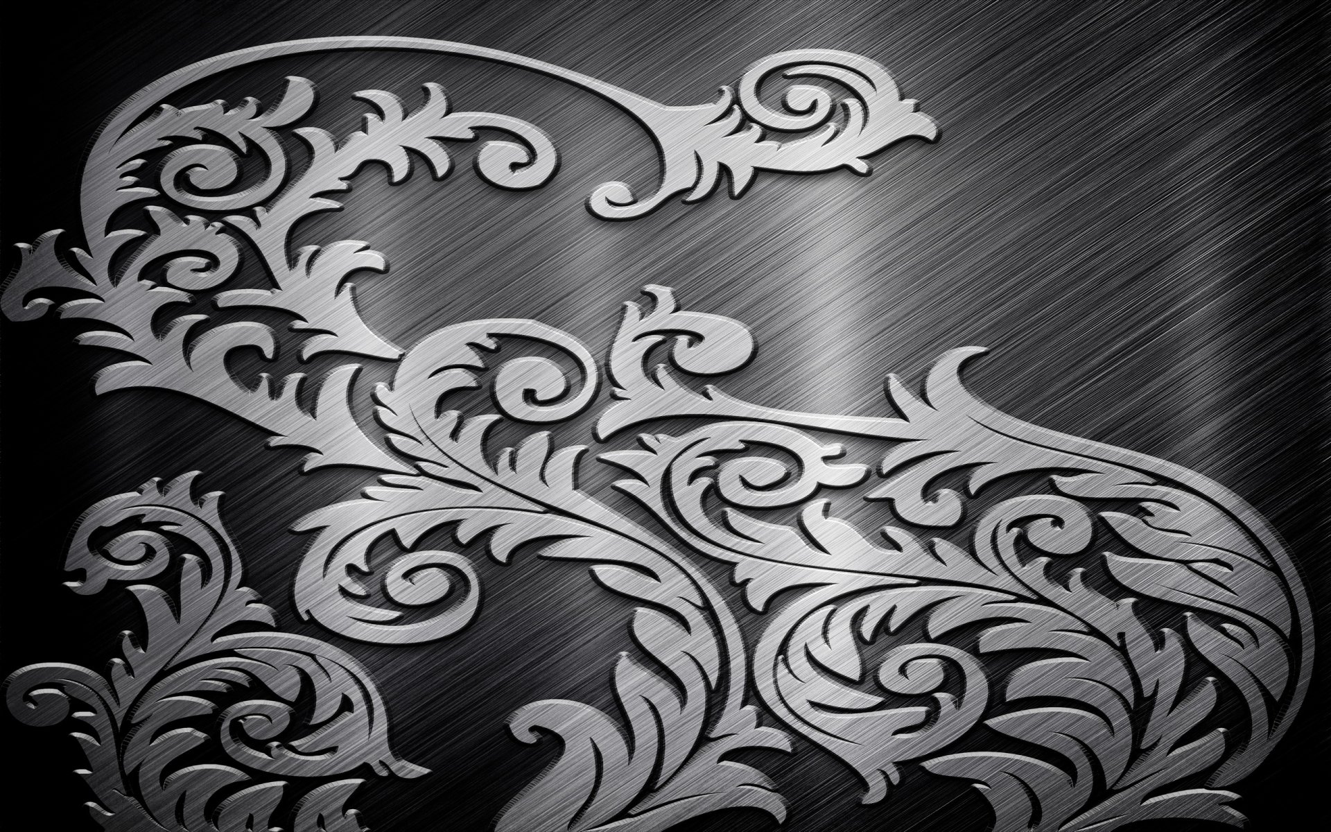 HD PC desktop wallpaper featuring an abstract, ornate metal design with intricate swirling patterns on a brushed metal background.