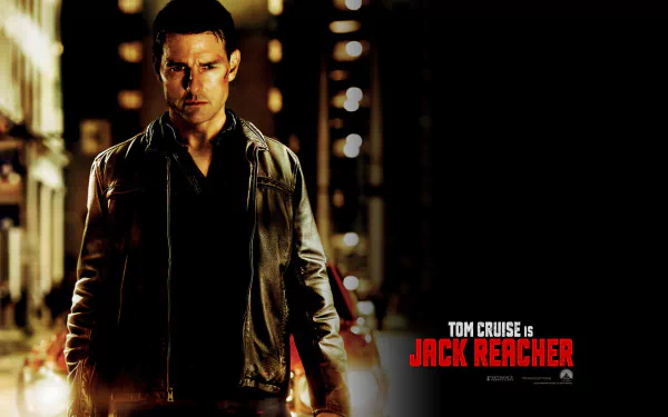 Tom Cruise stars as Jack Reacher in this HD wallpaper, featuring a dramatic pose against a city backdrop, capturing the intensity of the movie's action-packed moments.