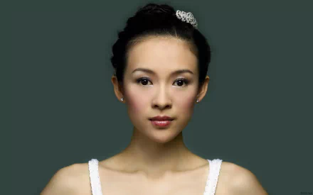 HD desktop wallpaper featuring celebrity Zhang Ziyi with a simple dark green background and elegant hairstyle.