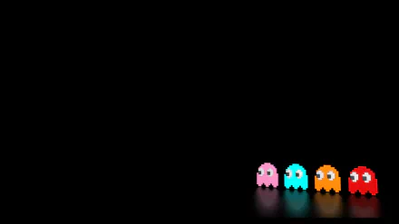 HD PC desktop wallpaper featuring classic Pac-Man video game ghosts in pink, blue, orange, and red against a solid black background.