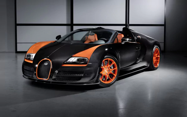 HD PC desktop wallpaper featuring a black and orange Bugatti Veyron Grand Sport Vitesse parked indoors, showcasing its sleek design and vibrant accents.