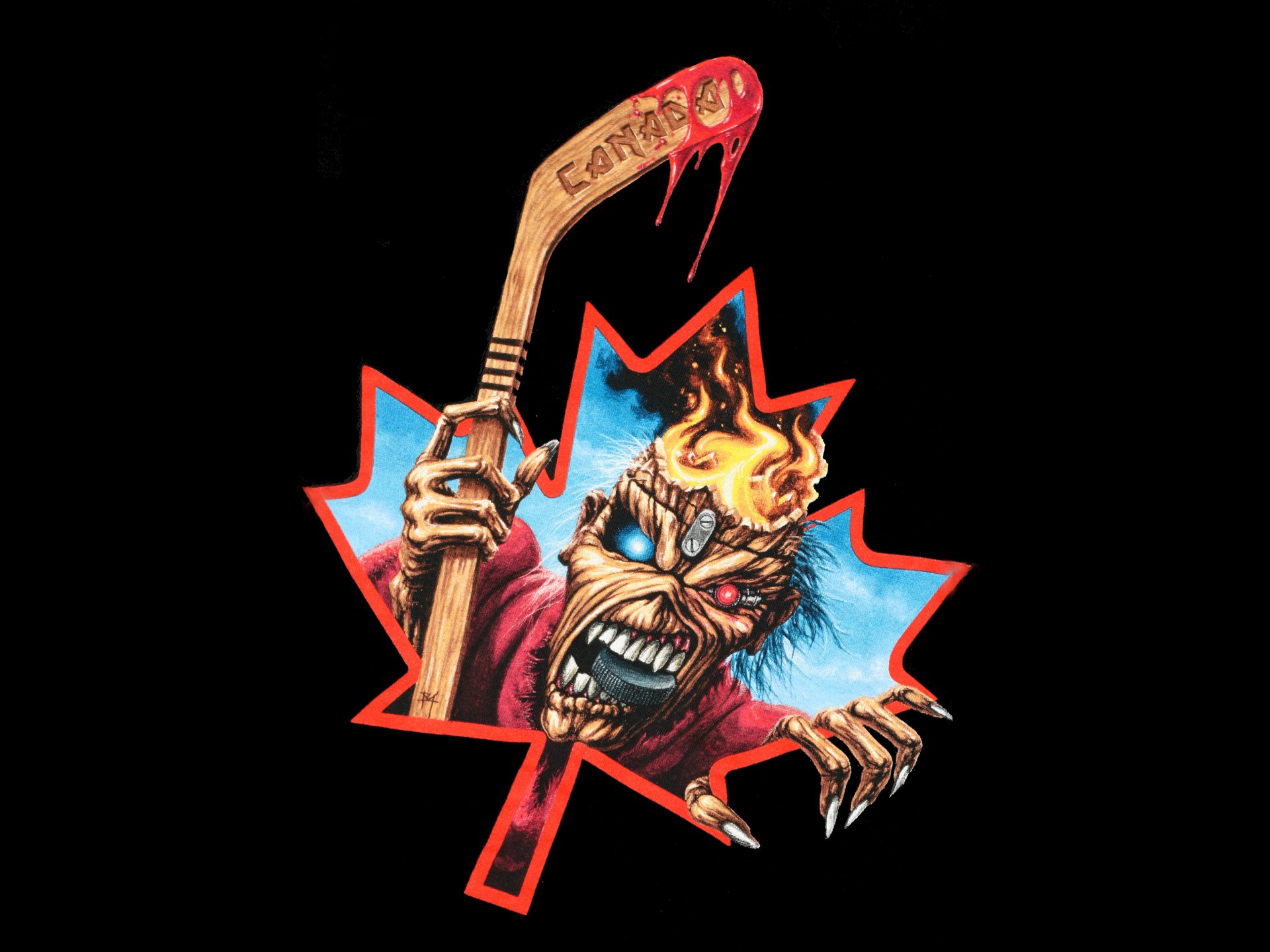 4K Ultra HD PC desktop wallpaper featuring Iron Maiden’s fiery mascot breaking through a red maple leaf, blending music and bold graphic art.