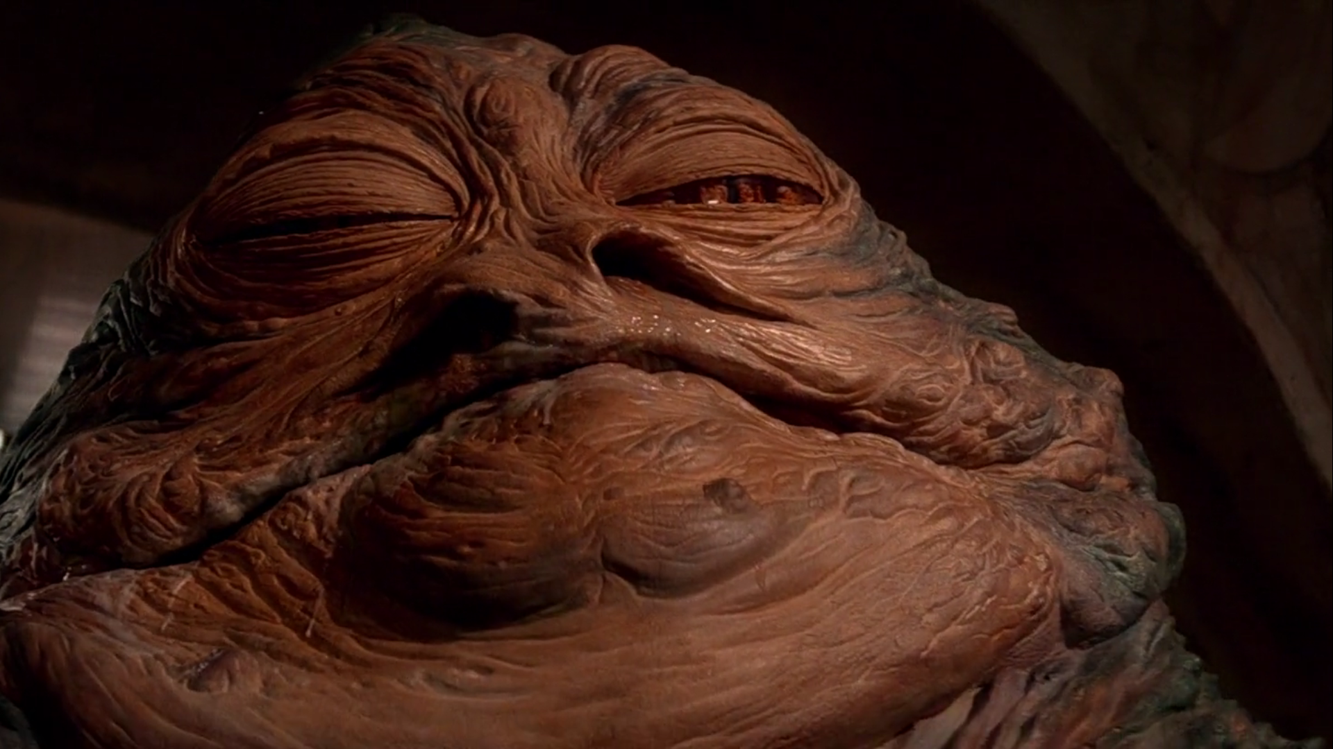 HD PC desktop wallpaper featuring a close-up of Jabba the Hutt from the Star Wars movie series.