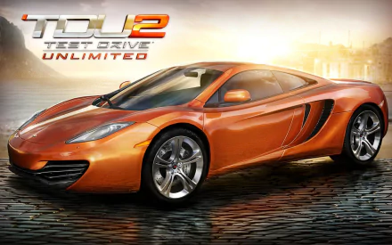 Orange sports car on wet reflective pavement with a hazy city backdrop and Test Drive Unlimited 2 logo — racing video game 2K Quad HD PC desktop wallpaper/background.