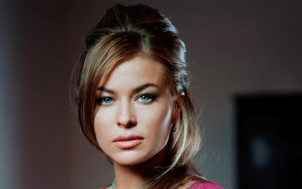 HD desktop wallpaper featuring a close-up portrait of celebrity Carmen Electra with a soft-focus background.