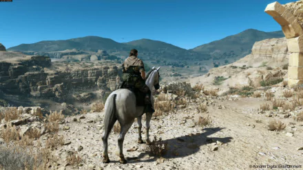 HD PC desktop wallpaper of Metal Gear Solid V: The Phantom Pain featuring a character on horseback overlooking a vast desert canyon landscape.