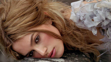 Close-up portrait of celebrity Keira Knightley, showcasing her elegant features and flowing hair. This high-definition image serves as a striking desktop wallpaper.