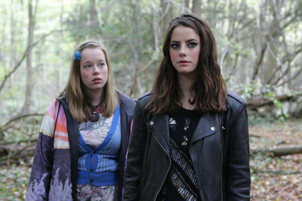 HD PC desktop wallpaper from the TV show Skins (2007) featuring two female characters standing in a forested area.