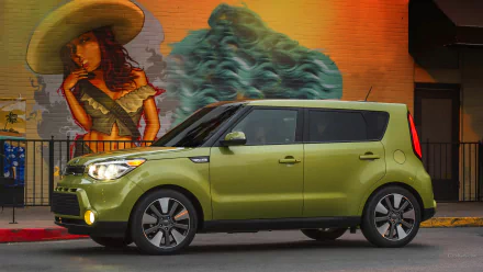 HD PC desktop wallpaper/background of a lime-green Kia Soul vehicle parked before a vibrant mural of a woman and abstract art.