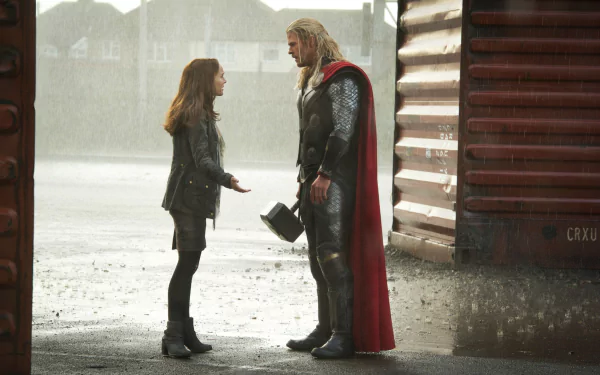 Chris Hemsworth as Thor in a scene from Thor: The Dark World, featured in an HD PC desktop wallpaper and background.