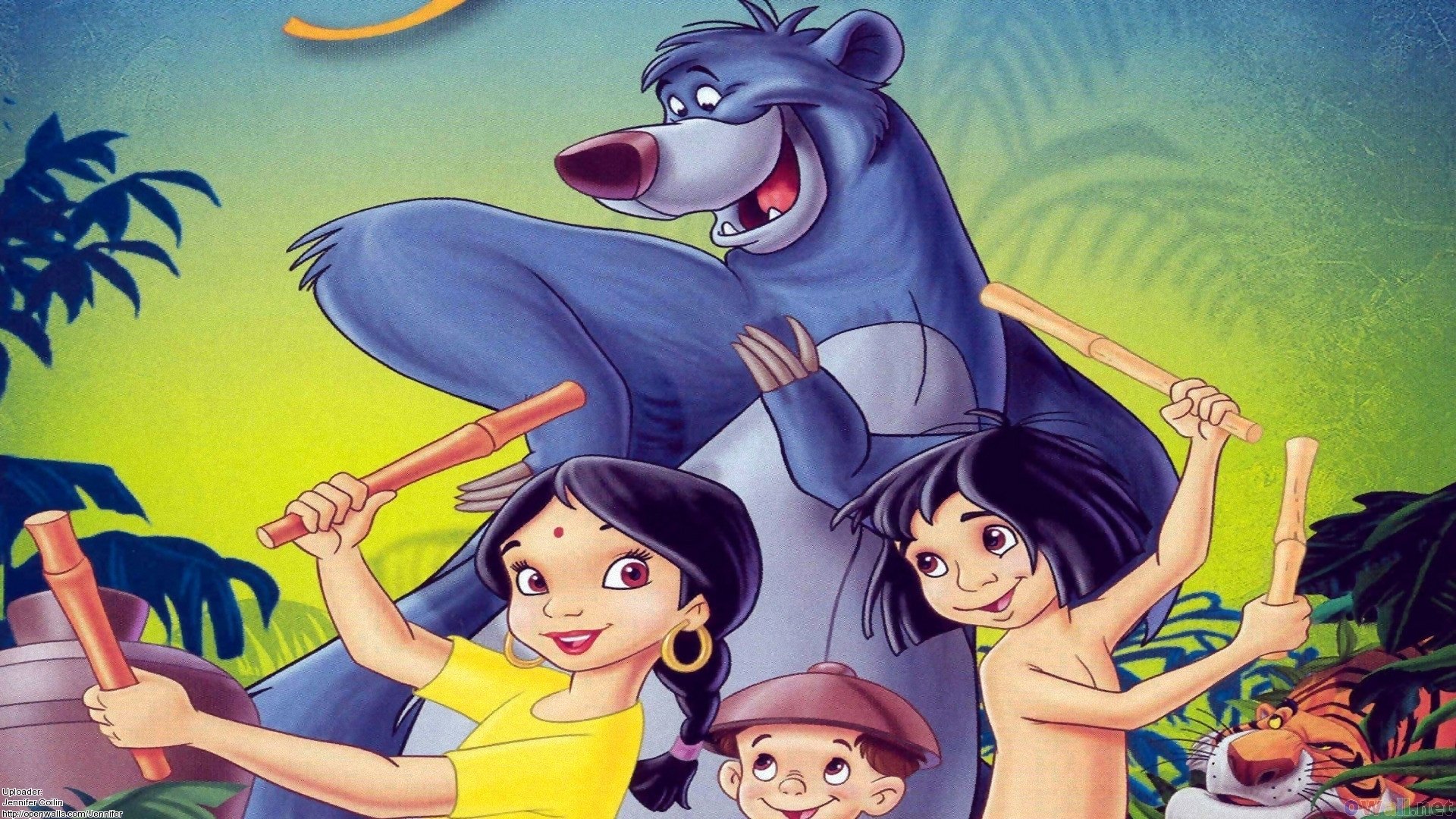 An HD jungle-themed desktop wallpaper featuring characters from the 1967 movie The Jungle Book, showing an animated bear with three children in a vibrant jungle setting.