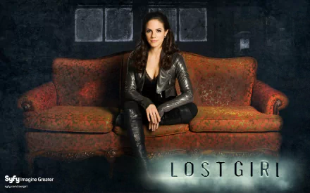 A dramatic image from the TV show Lost Girl, featuring the main character sitting confidently on a vintage sofa, set against a dark, moody background.