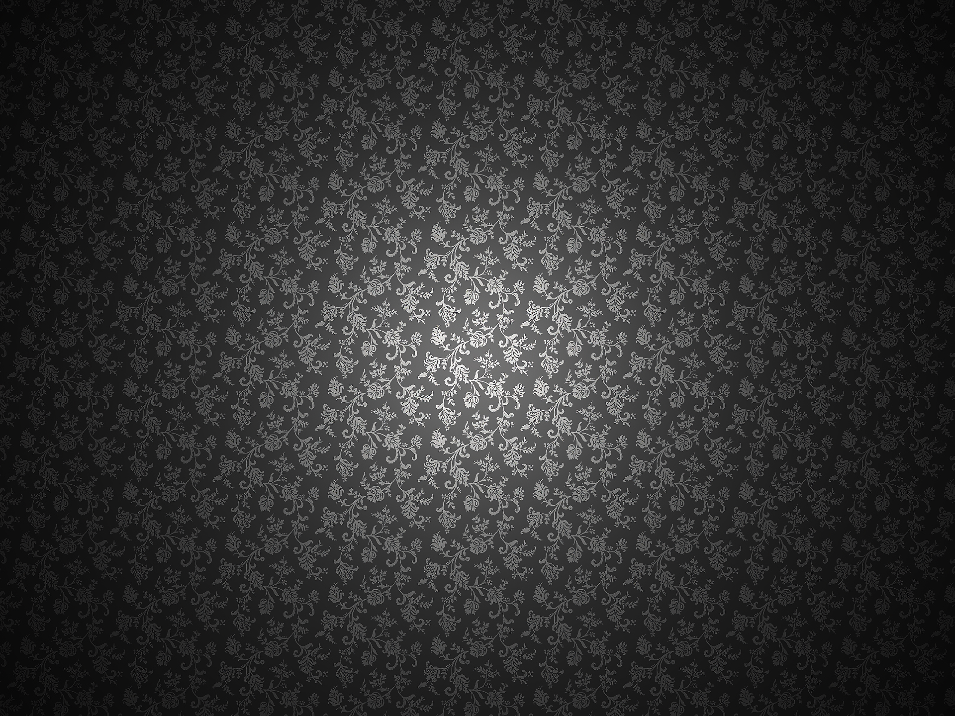 An abstract pattern wallpaper featuring intricate floral designs in shades of gray, creating a sophisticated and textured background for HD desktop use.