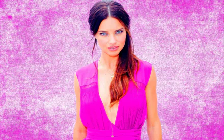 A vibrant HD wallpaper featuring celebrity Adriana Lima in a striking pink outfit, against a textured purple background, showcasing her stunning beauty and charm.