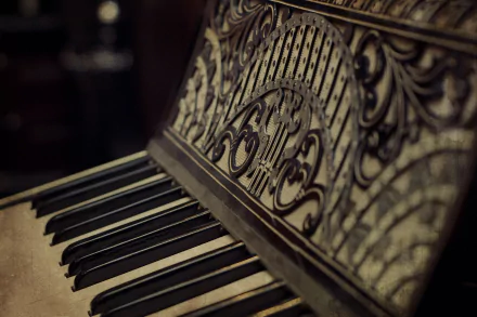 HD PC desktop wallpaper featuring a close-up of an ornate piano keyboard and music stand with intricate carvings, highlighting music and piano themes.