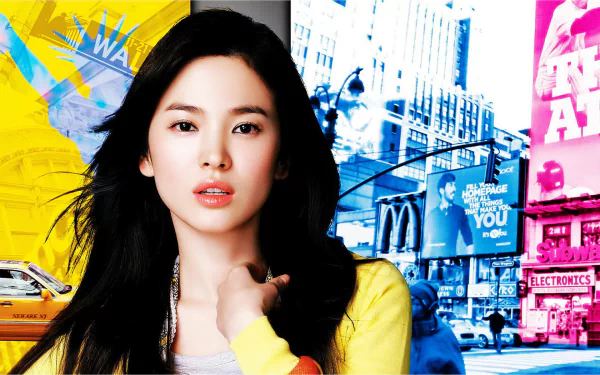 A stunning HD desktop wallpaper featuring South Korean actress Song Hye-kyo against a vibrant urban backdrop, showcasing her captivating beauty and charisma.