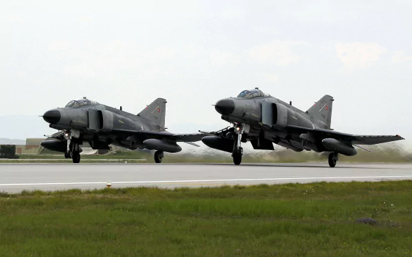  A Pair of F-4 Phantoms taking off.