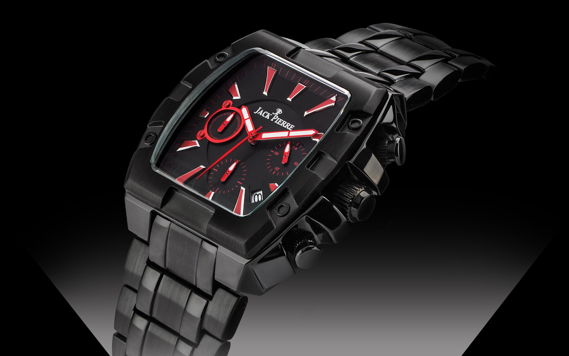 HD desktop wallpaper featuring a sleek, black Jack Pierre man-made watch with red accents on the dial, highlighted against a gradient dark background.