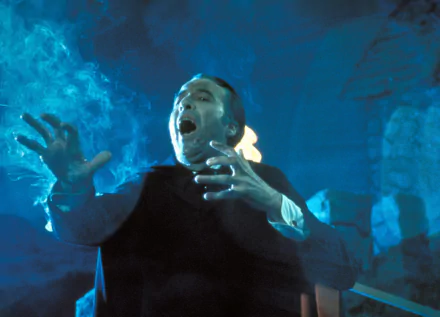 HD PC desktop wallpaper featuring a dramatic scene from the movie Scars of Dracula, showcasing intense lighting and a startled character in a dark, eerie setting.