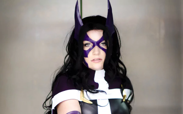 HD desktop wallpaper featuring a woman cosplaying as Huntress from DC Comics, wearing the character’s signature purple and black costume with a mask and long black hair.