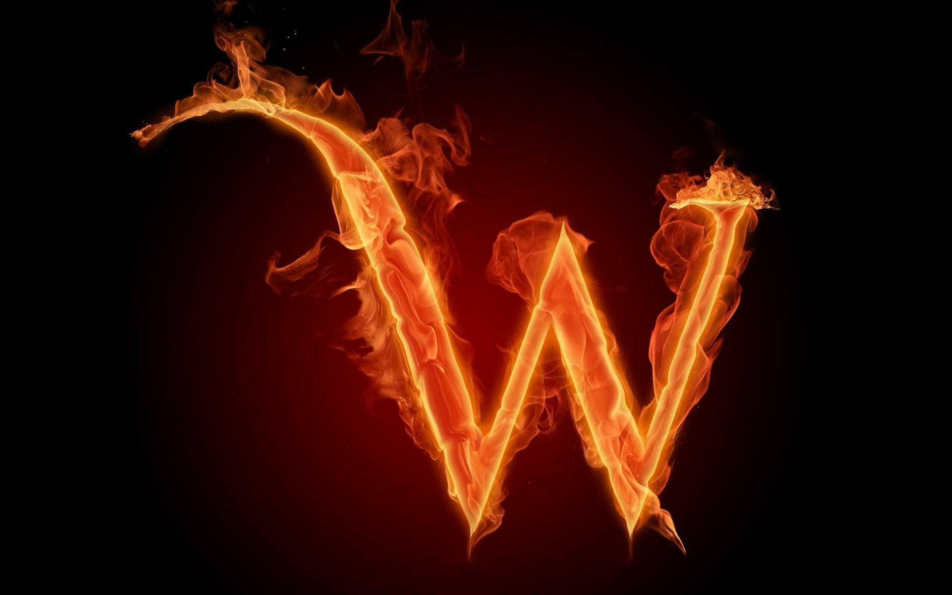 Artistic HD PC desktop wallpaper featuring a fiery flame forming the letter W against a black background.