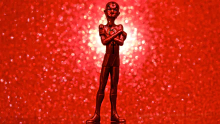 HD PC desktop wallpaper featuring a stylized Metal Men character from DC Comics, standing with arms crossed against a vibrant red sparkling background.