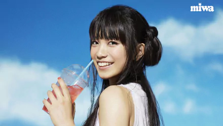 HD PC desktop wallpaper featuring Miwa smiling against a blue sky while holding a drink, capturing a bright and cheerful music-themed vibe.