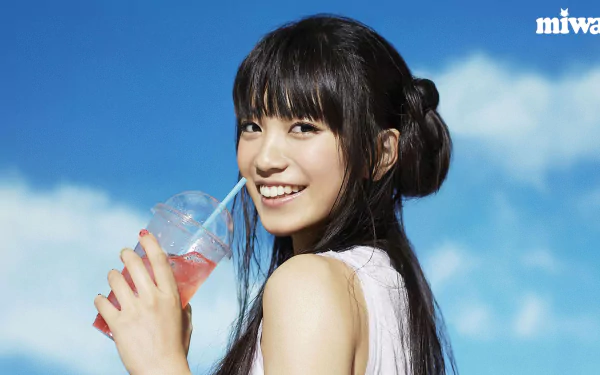 HD PC desktop wallpaper featuring Miwa smiling against a blue sky while holding a drink, capturing a bright and cheerful music-themed vibe.