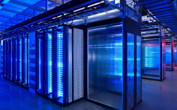 HD desktop wallpaper of a Google Data Center, showcasing advanced technology with blue lighting illuminating server racks and infrastructure.