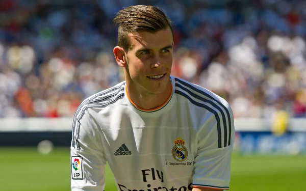 Gareth Bale in a Real Madrid C.F. jersey captured during a match, featured in a high-definition PC desktop wallpaper.