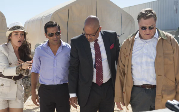 HD desktop wallpaper from Alpha House featuring four characters walking side by side with tense expressions, set against tents.