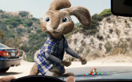 HD desktop wallpaper featuring the Easter Bunny from the movie Hop, standing in a scenic outdoor setting with a playful expression.