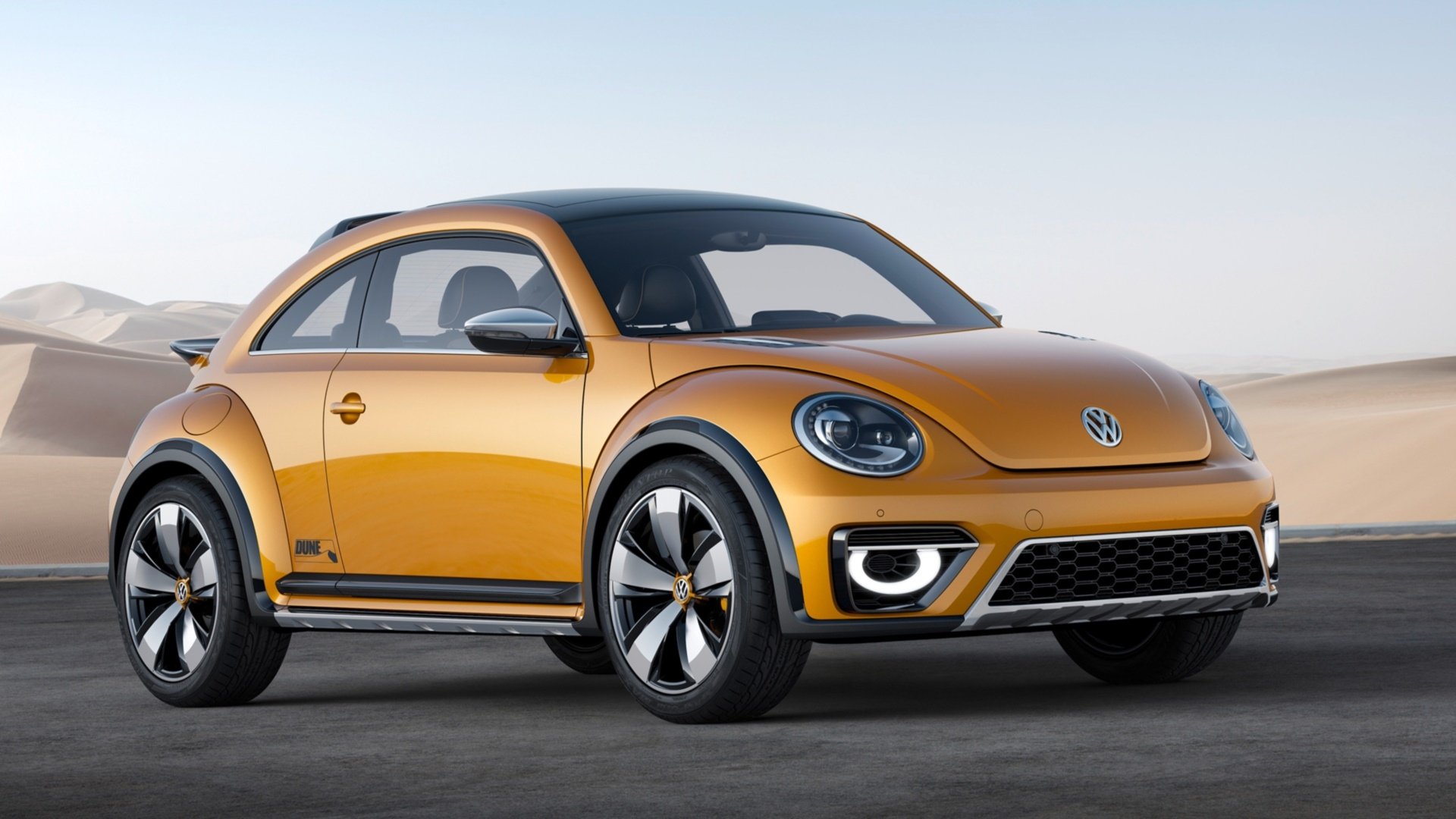 Yellow 2014 Volkswagen Beetle Dune Concept on a desert road, high-resolution HD PC desktop wallpaper background.
