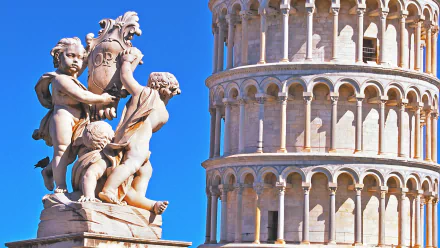 HD PC desktop wallpaper/background featuring a man-made cherub statue with the Leaning Tower of Pisa against a vivid blue sky.
