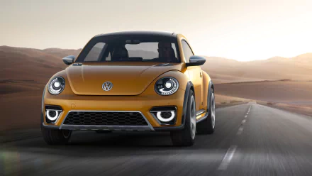 Front three-quarter view of a golden 2014 Volkswagen Beetle Dune Concept vehicle driving on a desert road at sunset — HD PC desktop wallpaper.