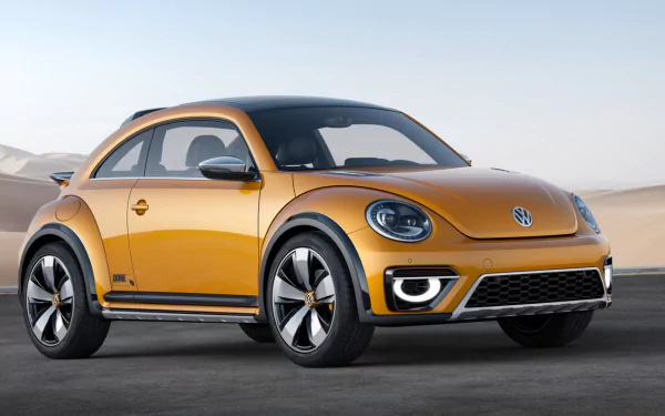 Yellow 2014 Volkswagen Beetle Dune Concept on a desert road, high-resolution HD PC desktop wallpaper background.