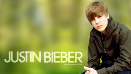 HD desktop wallpaper featuring a person with the text JUSTIN BIEBER on a blurred green background.