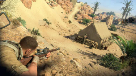 Sniper Elite III video game HD PC desktop wallpaper: a sniper crouches in desert foreground aiming at a tented enemy camp among sand dunes, rocks and palm trees.