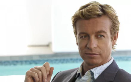 HD desktop wallpaper featuring Simon Baker as Patrick Jane from the TV show The Mentalist, with a calm and confident expression by a poolside.