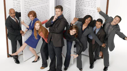 Cast of the TV show Castle posing dynamically against a backdrop of large, open book pages in an HD PC desktop wallpaper.