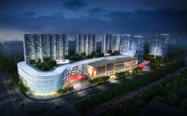 Night aerial HD desktop wallpaper of man-made Changsha: illuminated curved shopping mall flanked by high-rise residential towers and city streets.