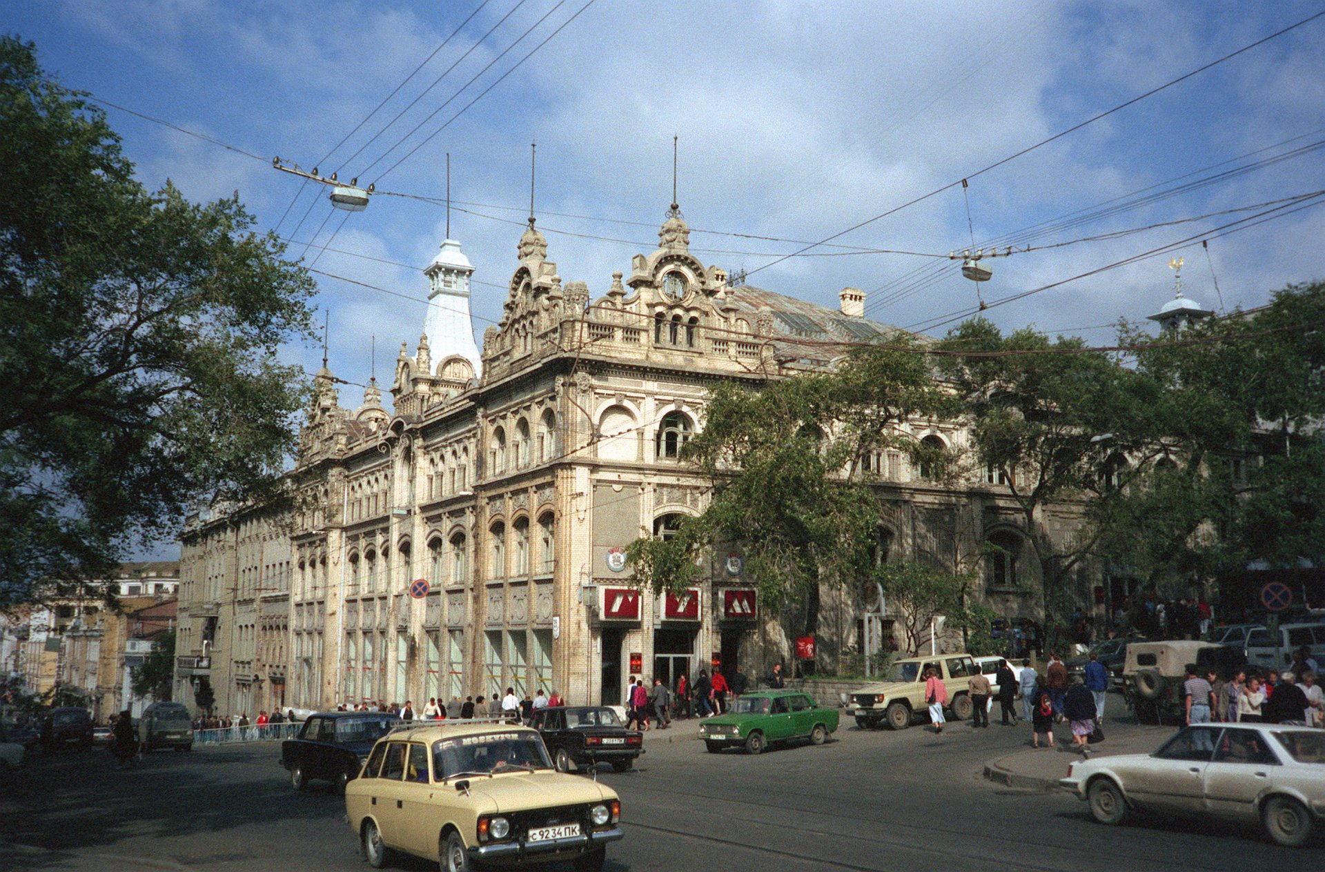 Historic architecture in Vladivostok, Russia, showcasing ornate details and vibrant street life, representing the essence of the USSR era. HD resolution for a striking desktop background.
